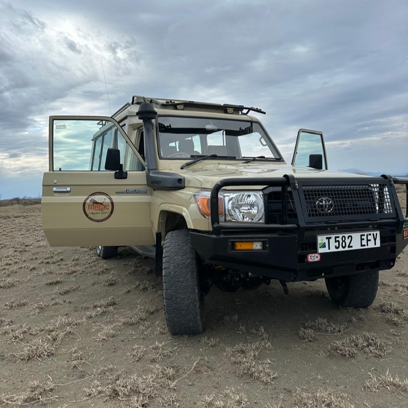 Magic of Wild Adventure Safaris Landcruizer Front and Side View with Doors Open